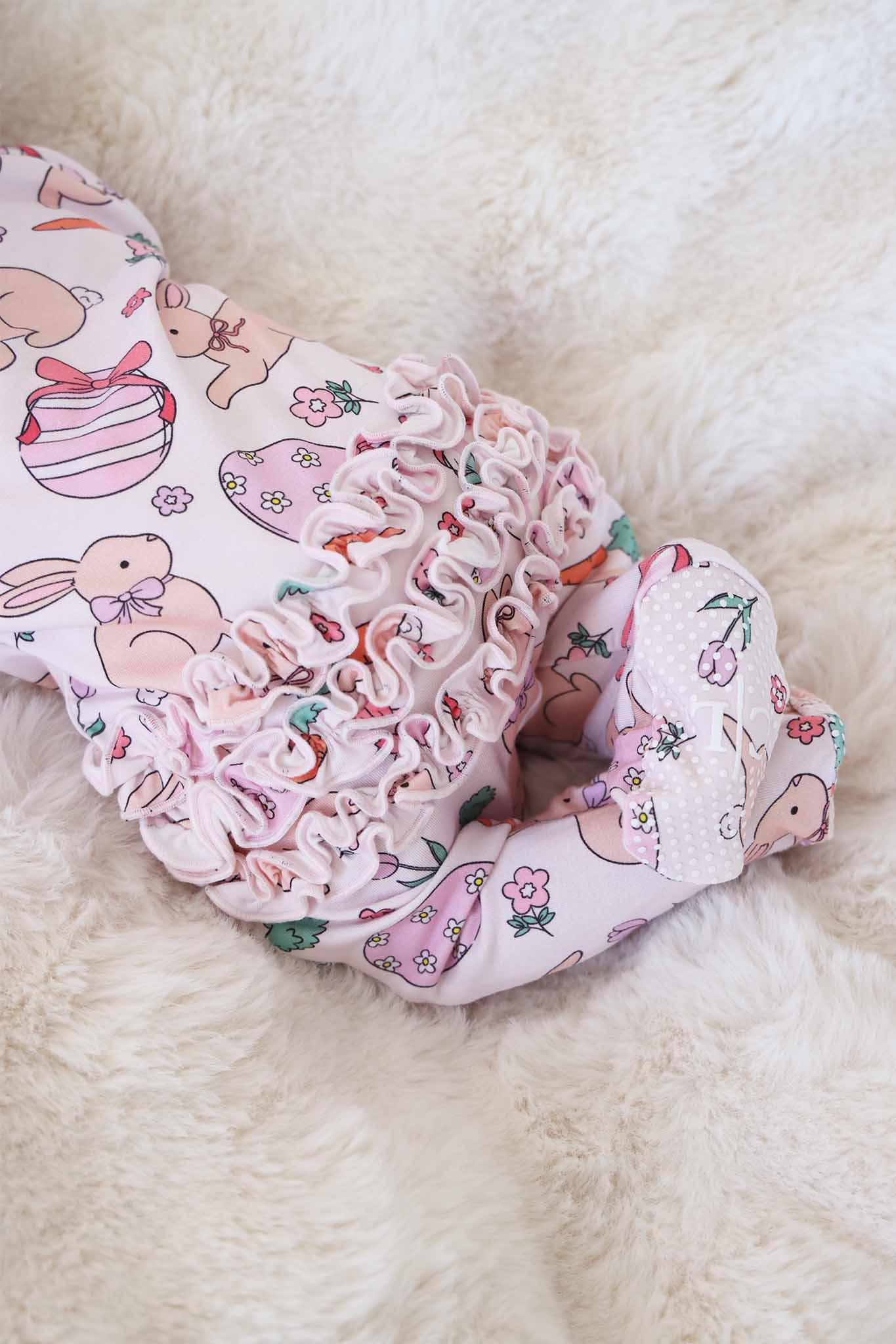 Hoppy Spring Ruffle Zipper Footie | Pink