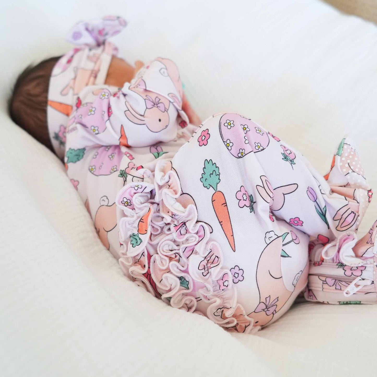 Hoppy Spring Ruffle Zipper Footie | Pink